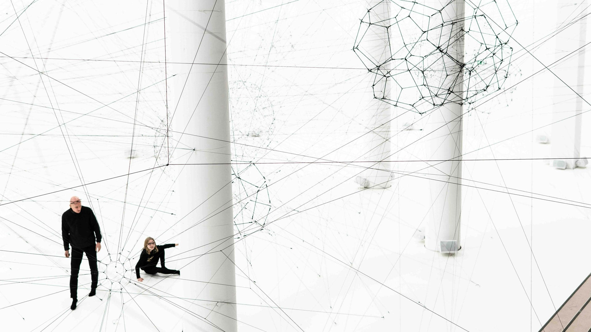 People sitting in a white room